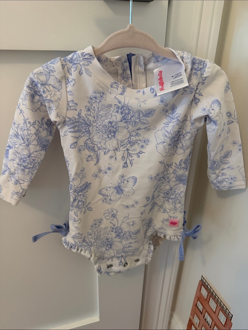 Ruffle Butts Cream and Blue Floral One-Piece with Bows